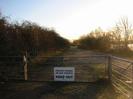 Gates and track on eastern side of Taplow Lake.
Hedges on each side of track.
Metal gate with sign: "PRIVATE FISHING / NO DAY TICKETS / KEEP OUT"