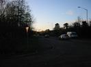 Looking west on the A4 Bath Road at sunset.
Trees on both sides.
Railway embankment on the right.