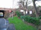 Looking north on Hitcham Road.
Railway bridge and traffic lights on left.
Embankment with beehives and trees on right.
